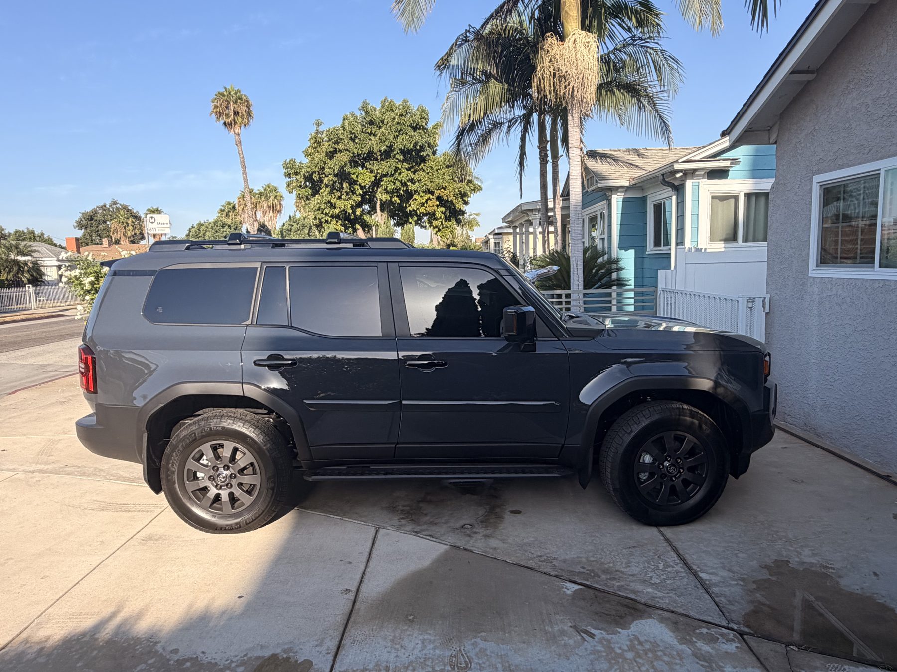 The same gray Toyota SUV after installation, its side windows now dark and even so the interior is no longer visible from outside