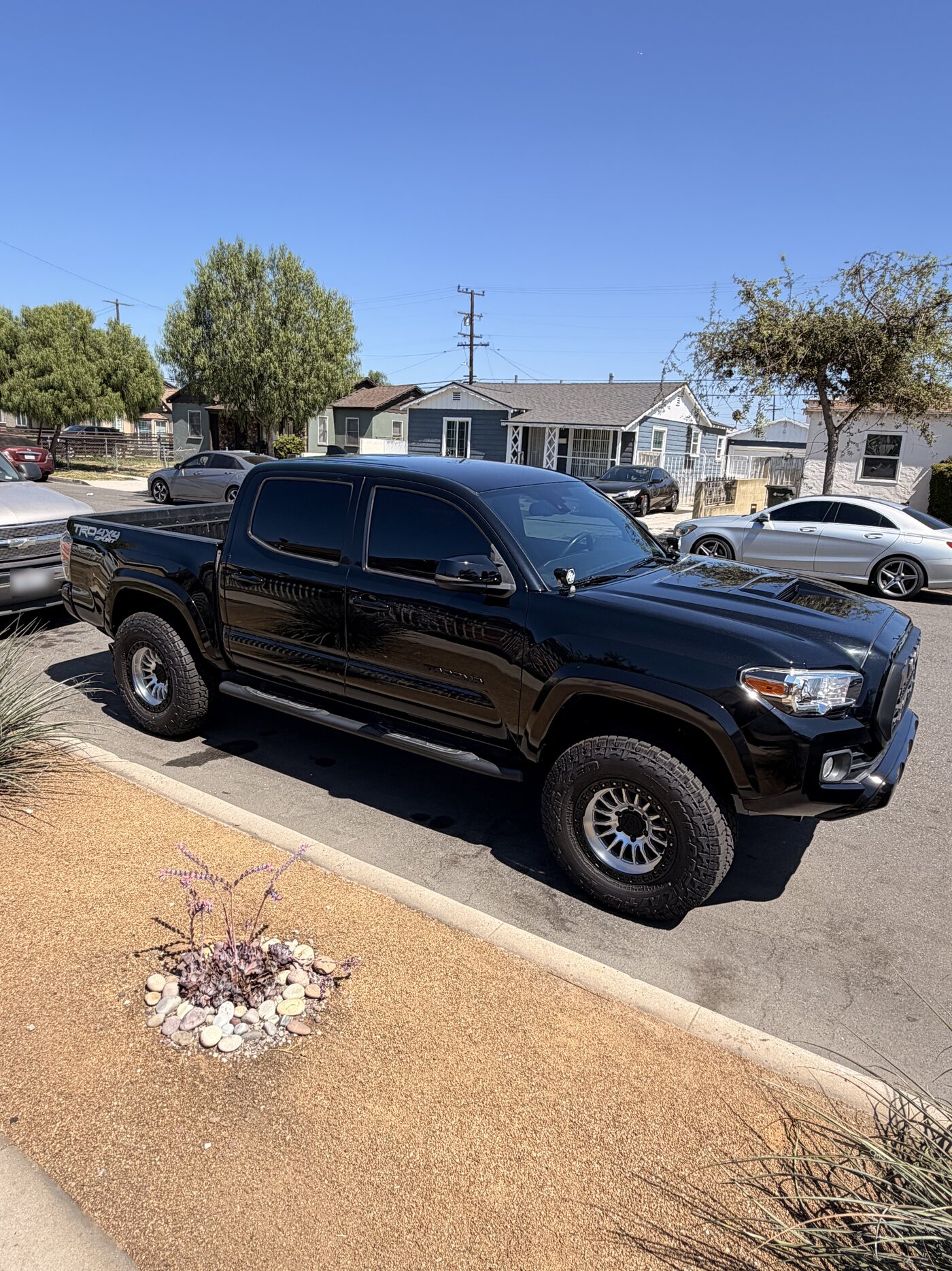 Black Toyota Tacoma TRD double cab with dark window tint installed